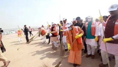 CM Yogi along with sanitation workers at Sangam Ghat